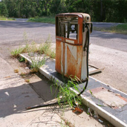 Image of old gas pump at an abandoned station.