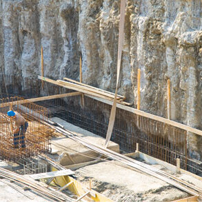 Construction worker at excavation site.